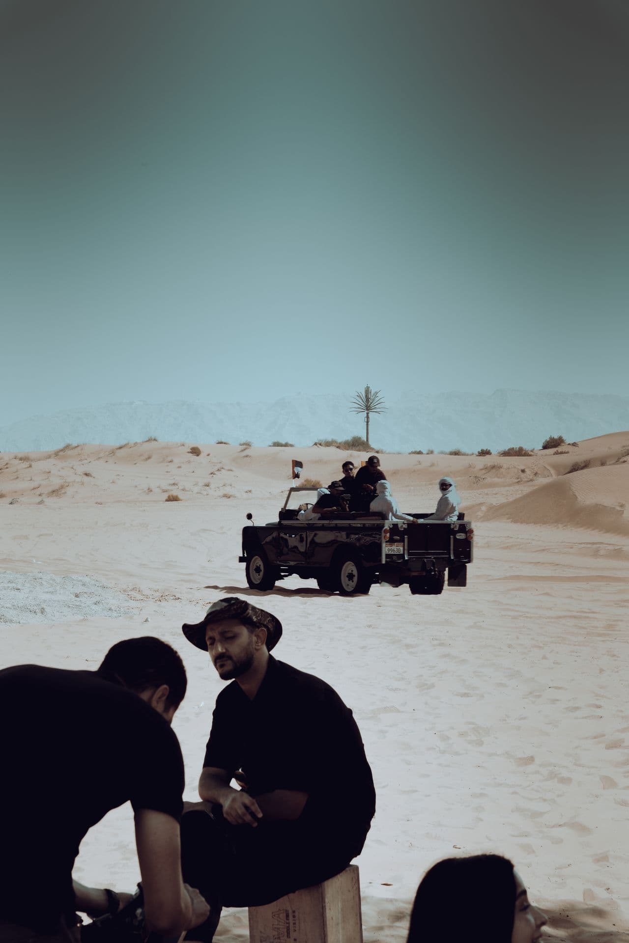 The crew filming the Land Rover from behind